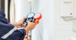 Professional air conditioning contractor checking HVAC system in Spring Hill Florida home